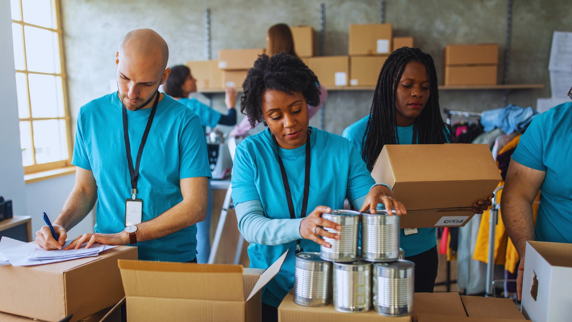 Volunteers preparing food donations for community outreach