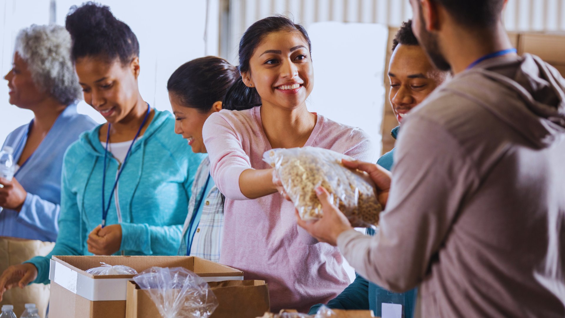 Volunteers sharing food with community members