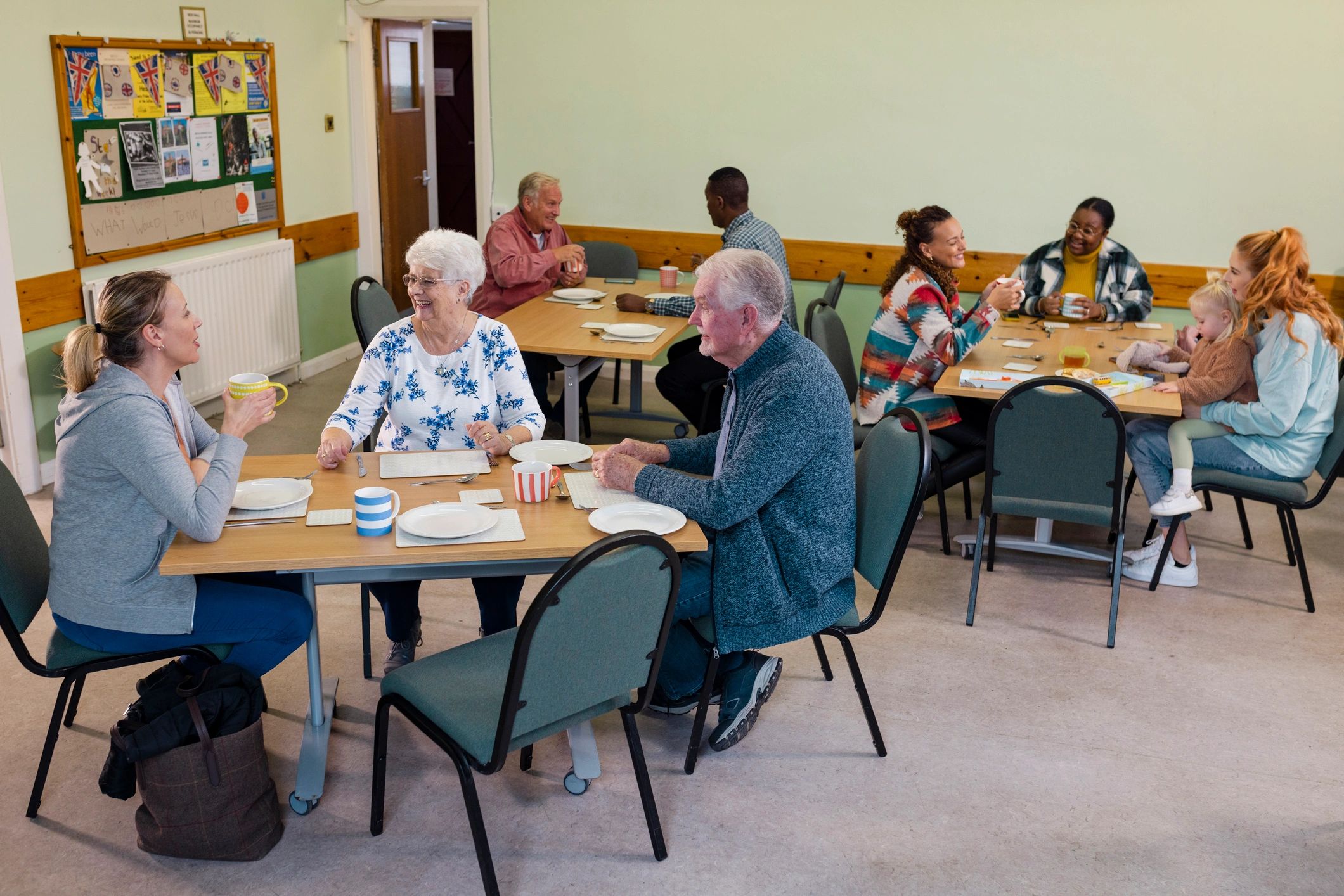 Community members gathered together in a welcoming outreach setting